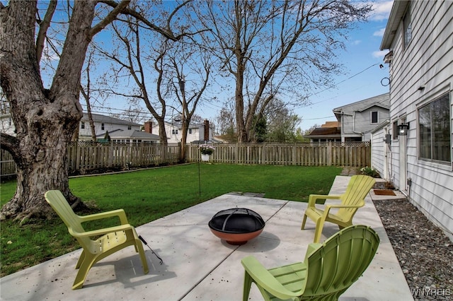 view of patio / terrace with a fenced backyard and an outdoor fire pit
