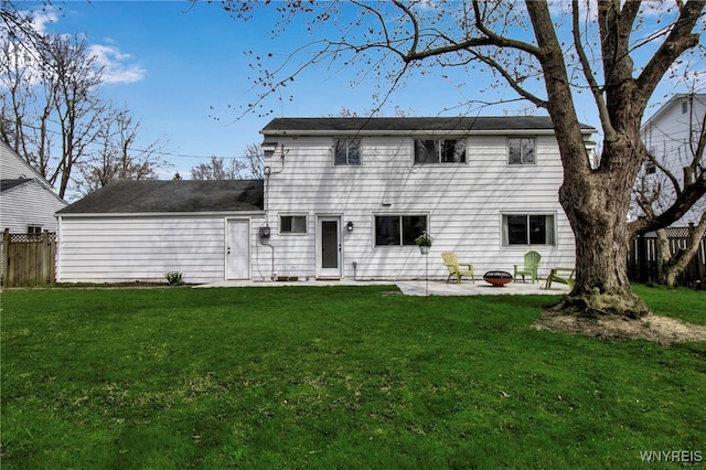back of property with a patio, fence, and a yard