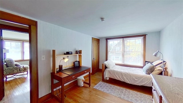 bedroom with light wood-style floors