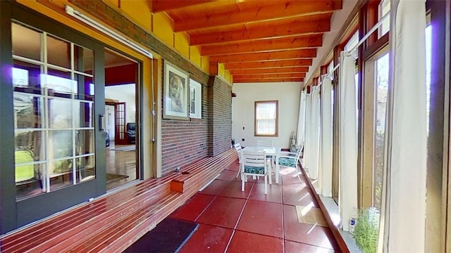 exterior space with beamed ceiling