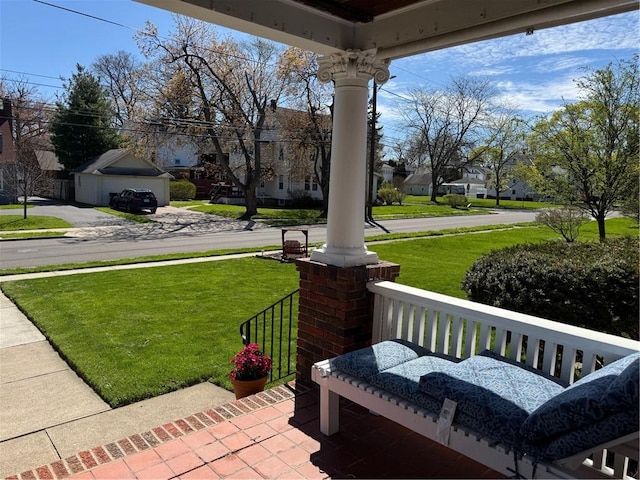 view of patio / terrace featuring a residential view and a porch