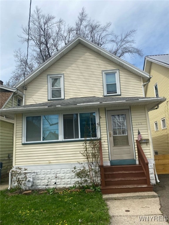 rear view of property featuring entry steps