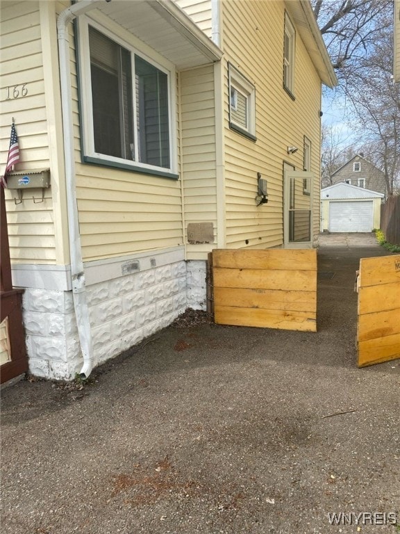 view of side of property with an outdoor structure