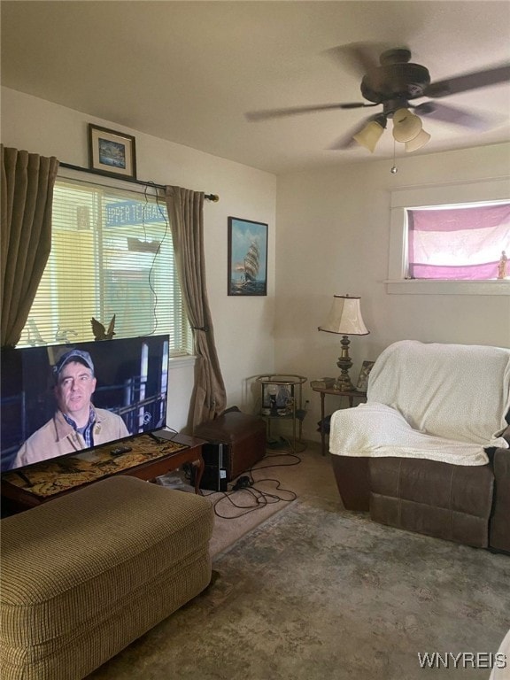 living room with carpet floors and a ceiling fan