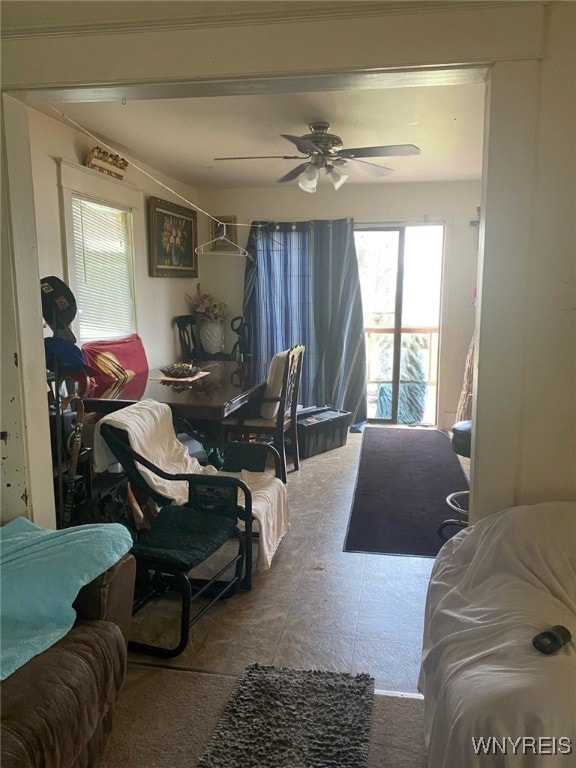 living area with ceiling fan