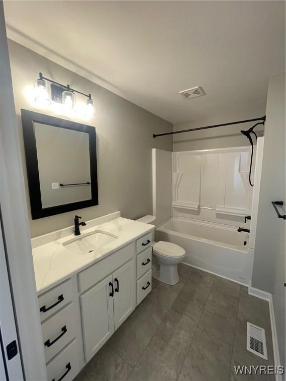 bathroom with vanity, toilet, bathing tub / shower combination, and visible vents