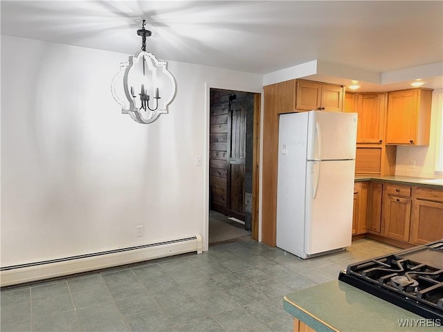 kitchen with hanging light fixtures, a baseboard radiator, freestanding refrigerator, a chandelier, and light tile patterned flooring