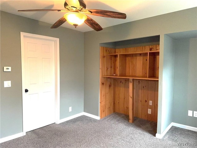 unfurnished bedroom with carpet floors, a ceiling fan, baseboards, and a closet
