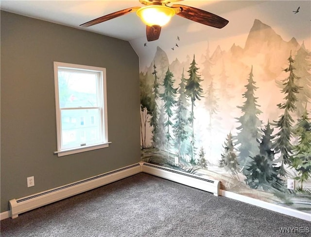 carpeted spare room with a ceiling fan and a baseboard heating unit