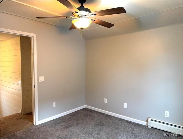 spare room with baseboards, ceiling fan, baseboard heating, and dark colored carpet