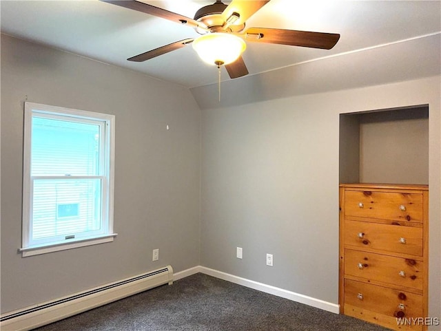 spare room featuring baseboards, a baseboard radiator, a ceiling fan, and dark carpet
