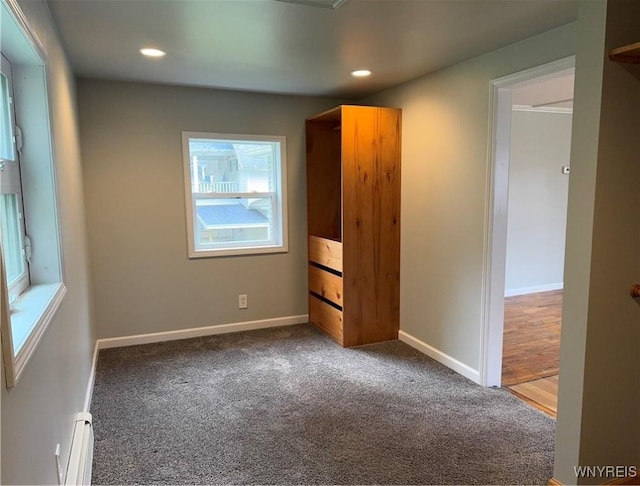 unfurnished bedroom featuring carpet floors, recessed lighting, baseboards, and baseboard heating