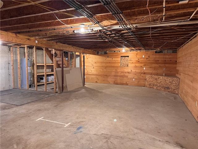 3300 County Road 7, Hector, NY 14865 - unfinished basement featuring water heater and wood walls