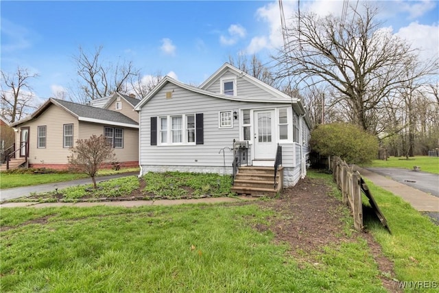 view of front of property featuring a front yard and entry steps