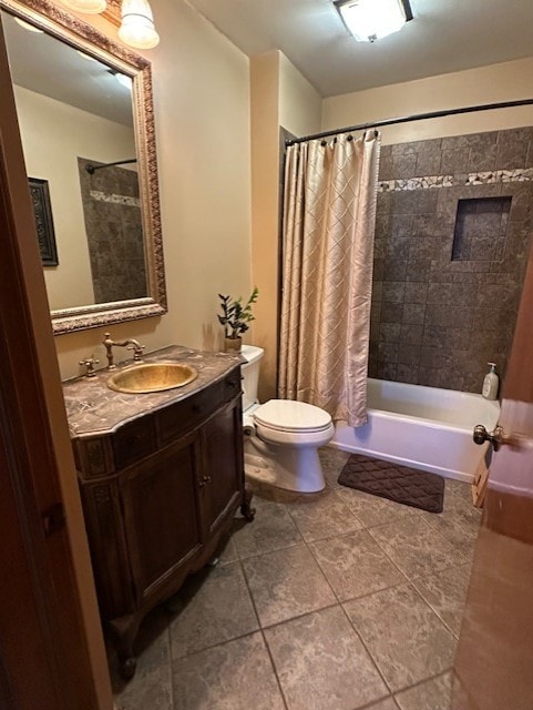 full bath with vanity, tile patterned floors, toilet, and shower / tub combo with curtain
