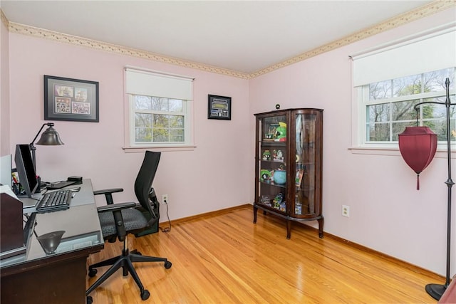 home office with baseboards and light wood-style floors