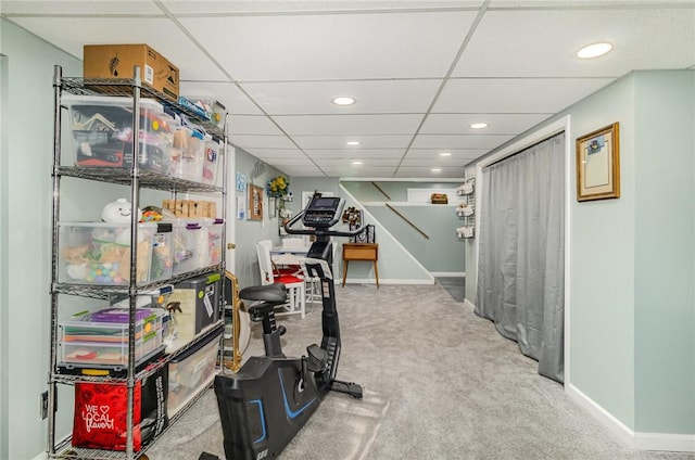 workout room featuring carpet flooring, recessed lighting, baseboards, and a paneled ceiling