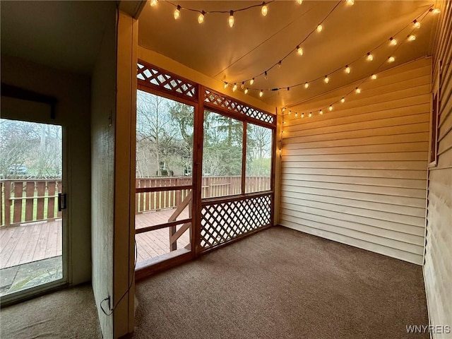 unfurnished sunroom featuring a wealth of natural light