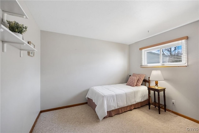 carpeted bedroom featuring baseboards