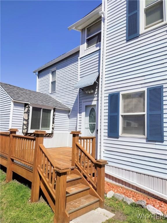 back of property with a deck
