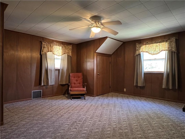 unfurnished room with visible vents, carpet, and a healthy amount of sunlight