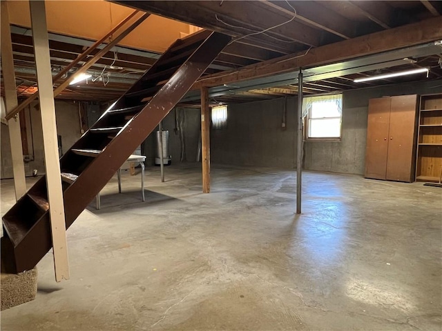 basement featuring stairs