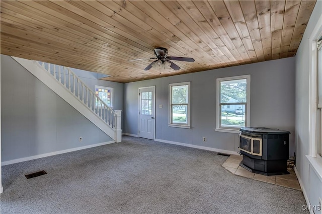 11931 State Route 12e, Lyme, NY 13622 - foyer featuring carpet floors, healthy amount of natural light, a wood stove, and wood ceiling