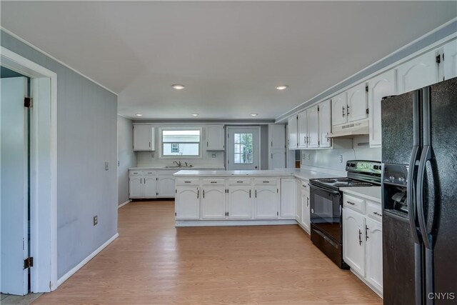 11931 State Route 12e, Lyme, NY 13622 - kitchen featuring black appliances, light countertops, white cabinets, light wood finished floors, and recessed lighting
