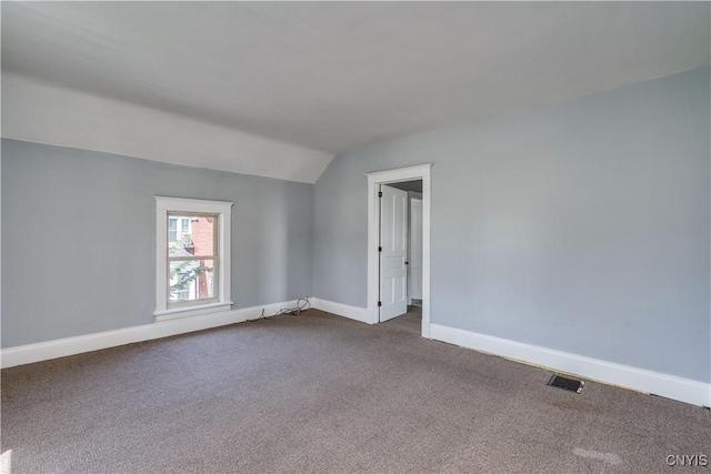 11931 State Route 12e, Lyme, NY 13622 - spare room featuring lofted ceiling and dark carpet