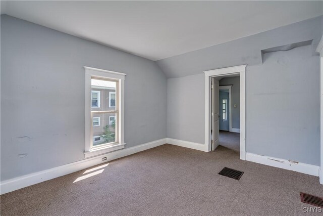 11931 State Route 12e, Lyme, NY 13622 - carpeted empty room with vaulted ceiling and baseboards
