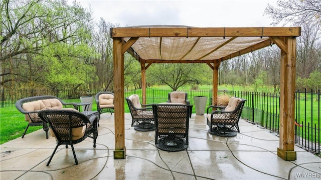 view of patio / terrace with a fenced backyard, a pergola, and an outdoor living space