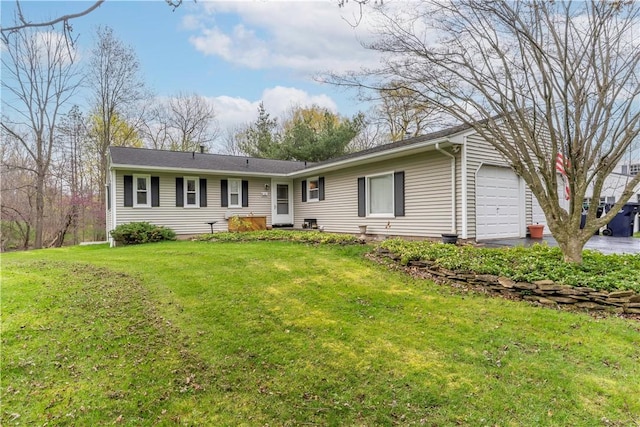 single story home featuring an attached garage and a front lawn