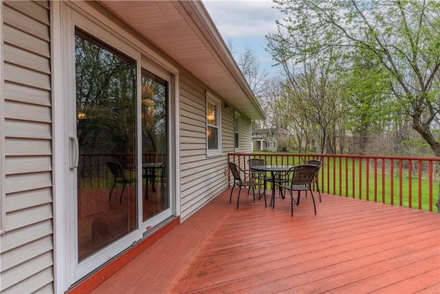 wooden deck with outdoor dining space