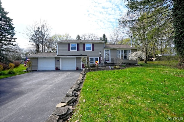 tri-level home featuring driveway and a front lawn