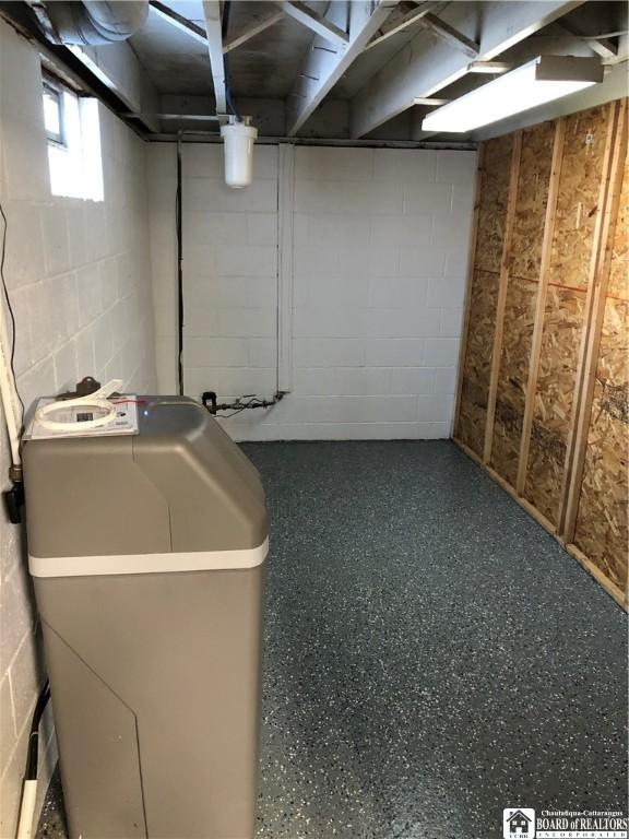 basement with concrete block wall