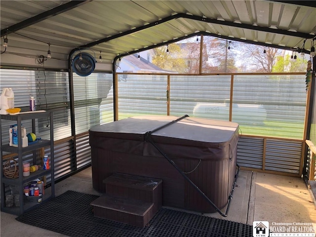 exterior space with a hot tub