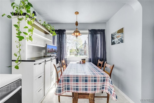 dining room featuring baseboards