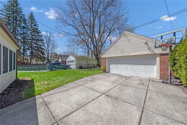 detached garage featuring fence