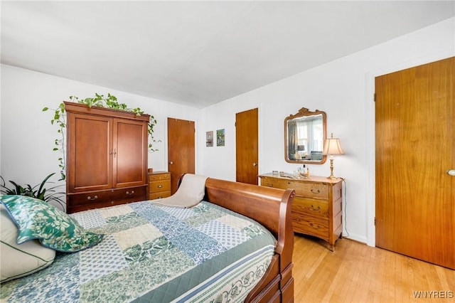 bedroom with light wood-type flooring