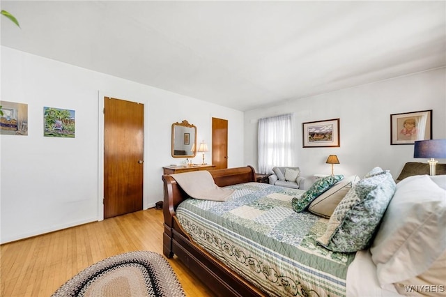 bedroom with light wood finished floors