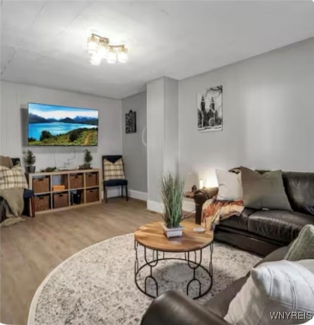 living room featuring baseboards and wood finished floors