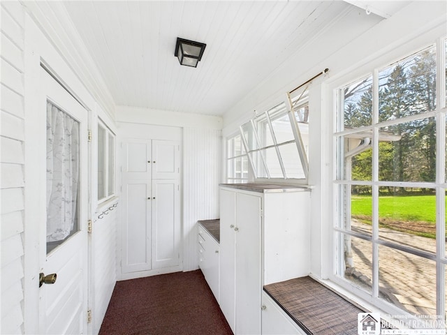 interior space featuring wooden ceiling