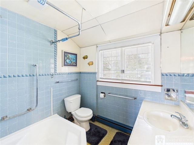 full bath with shower / tub combination, vanity, toilet, and tile walls