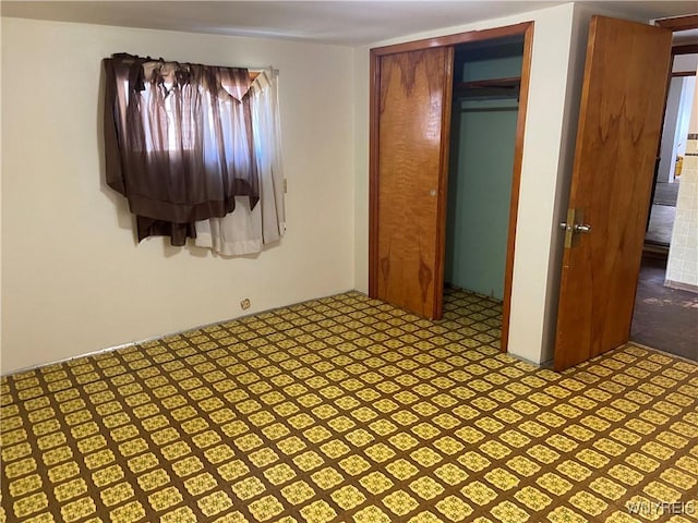 unfurnished bedroom featuring a closet