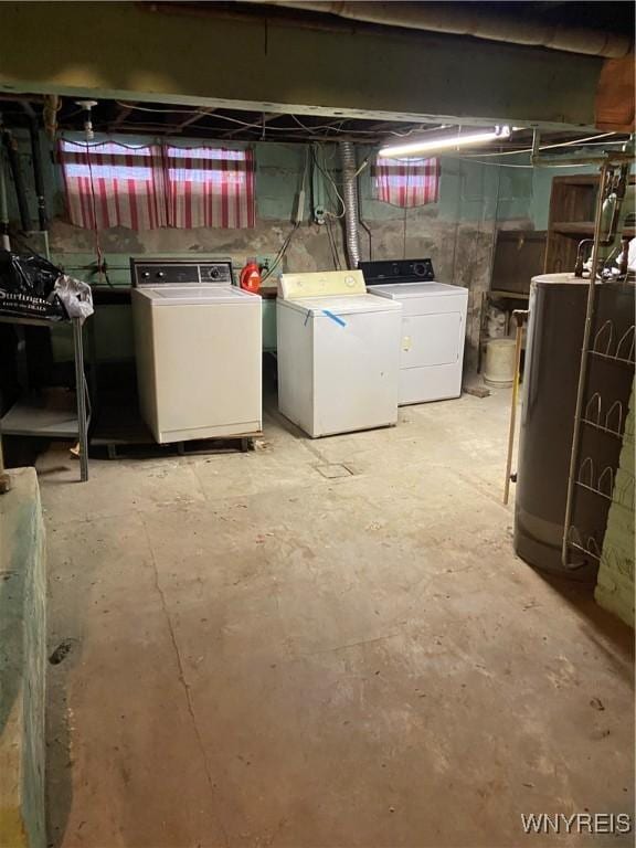 unfinished basement featuring gas water heater and independent washer and dryer