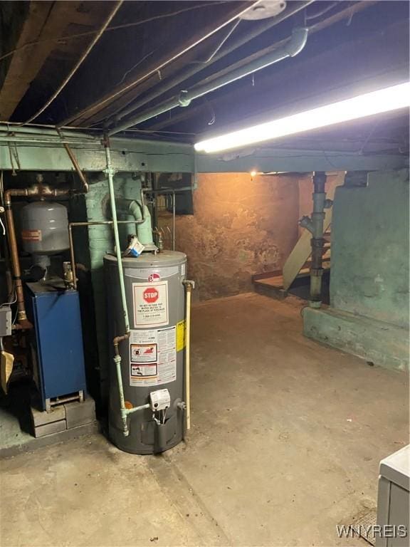 unfinished basement featuring a heating unit and gas water heater