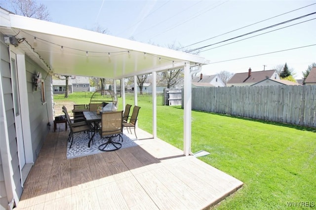 view of patio featuring outdoor dining area, a fenced backyard, and a deck