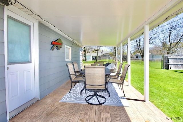 view of patio with outdoor dining area and fence