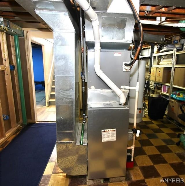 utility room featuring gas water heater