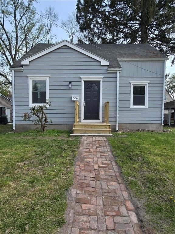 506 Luce St, Elmira-City, NY 14904 - bungalow-style home featuring a front yard, roof with shingles, and entry steps